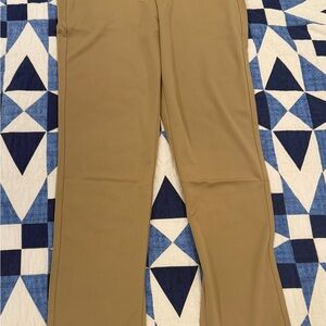 3 Men's Pants tan, dark blue, and black.